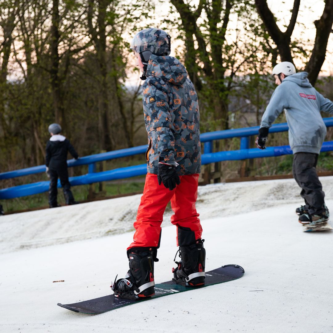 Man snowboarding, family activities in Rossendale